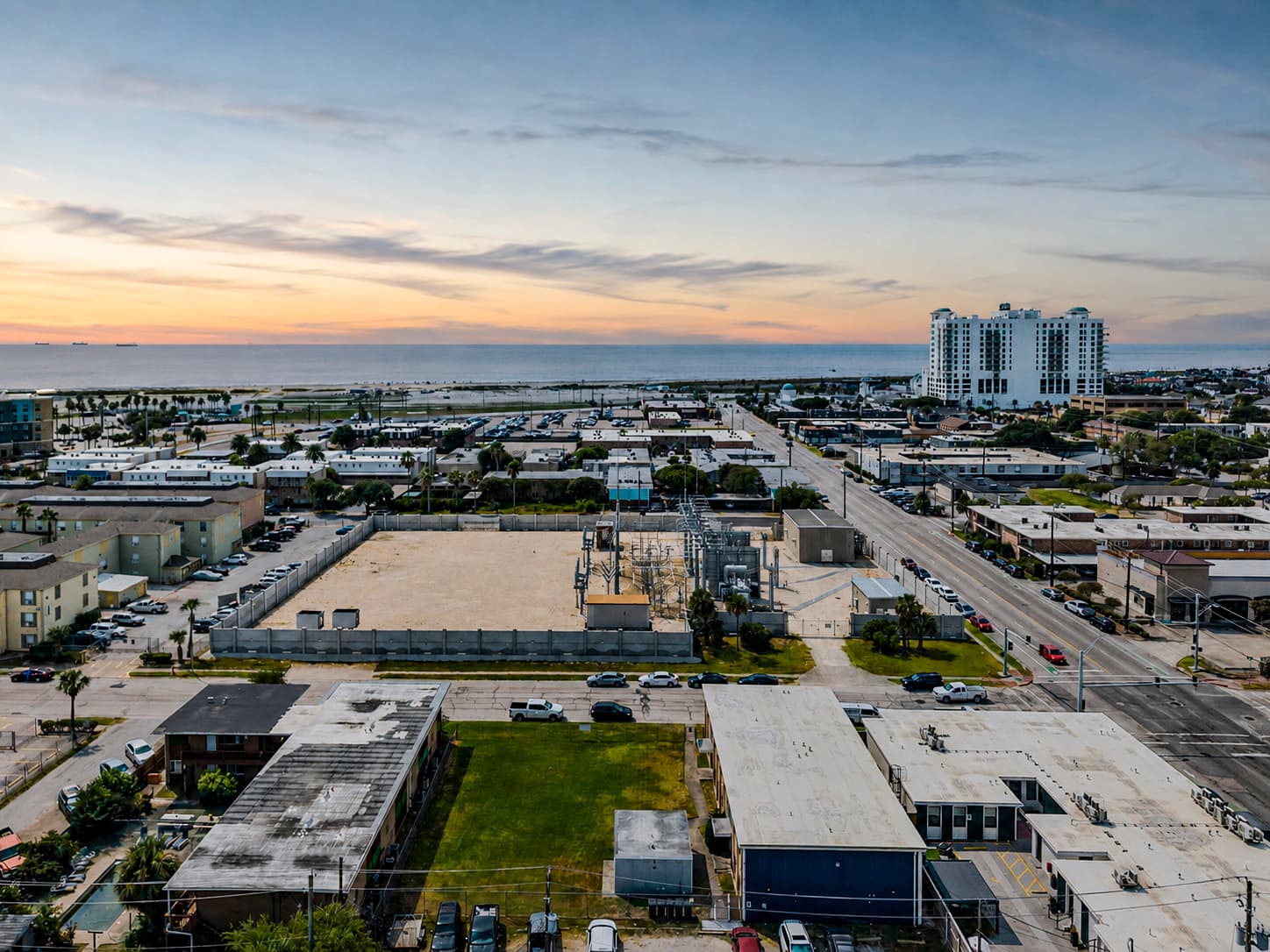 Aerial view of the Galveston coast toward the Gulf at golden hour